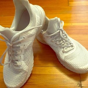 White pair of Nike renew sneakers